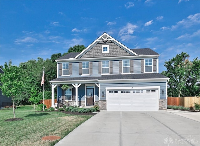 craftsman inspired home with a front yard, fence, a porch, concrete driveway, and a garage