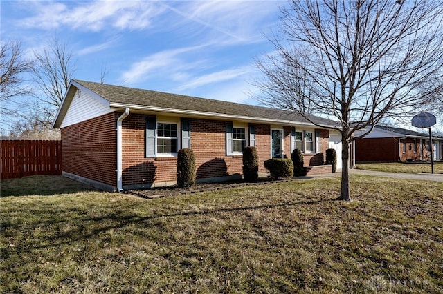 ranch-style home featuring fence, driveway, a front lawn, a garage, and brick siding