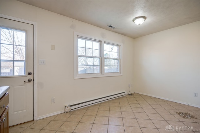 doorway to outside featuring light tile patterned flooring, baseboards, visible vents, and baseboard heating