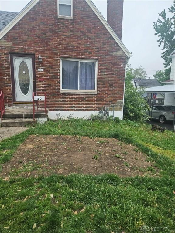 25 Redwood Ave, Dayton, OH 45405 - exterior space featuring brick siding and a chimney