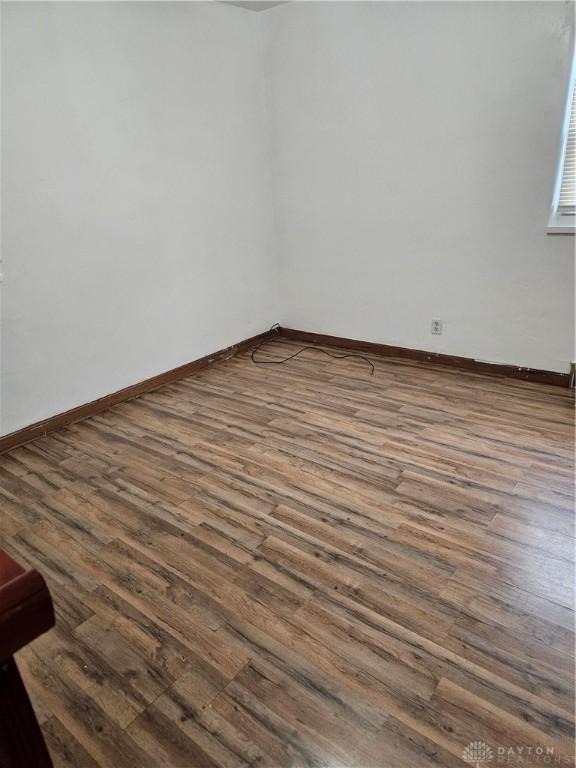 25 Redwood Ave, Dayton, OH 45405 - empty room with baseboards and dark wood-style flooring