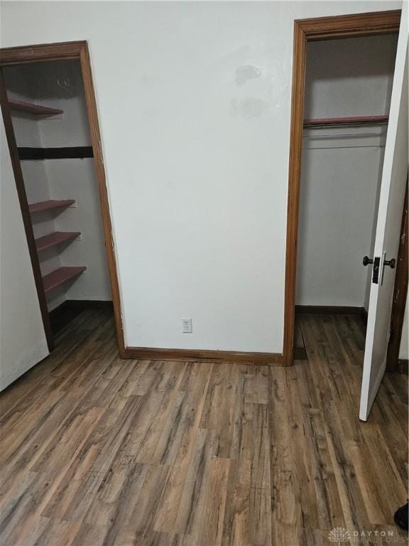 25 Redwood Ave, Dayton, OH 45405 - unfurnished bedroom with baseboards, wood finished floors, and a closet
