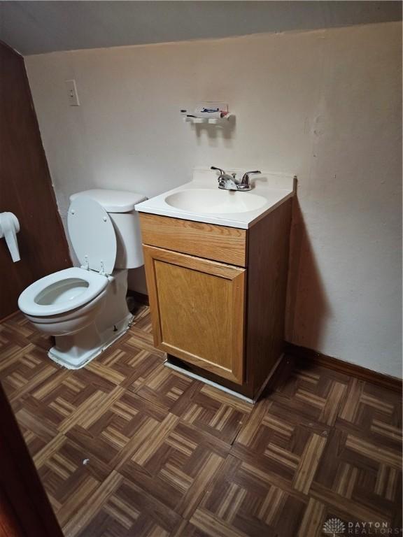 25 Redwood Ave, Dayton, OH 45405 - bathroom featuring vanity, baseboards, and toilet