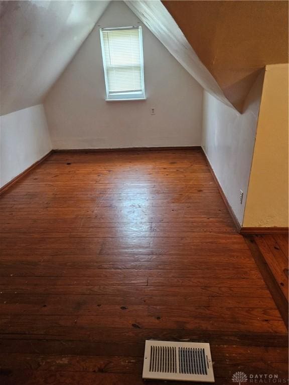 25 Redwood Ave, Dayton, OH 45405 - additional living space with vaulted ceiling, visible vents, baseboards, and hardwood / wood-style flooring