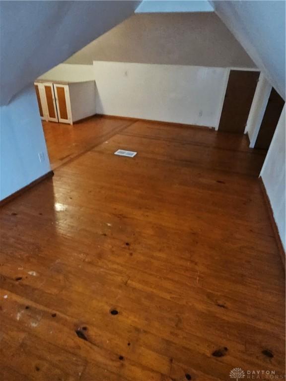 25 Redwood Ave, Dayton, OH 45405 - bonus room featuring vaulted ceiling, hardwood / wood-style flooring, and visible vents