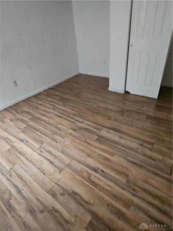 25 Redwood Ave, Dayton, OH 45405 - unfurnished bedroom with wood finished floors and a closet