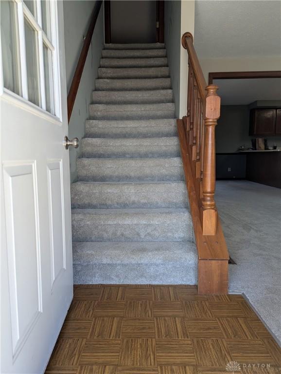 stairs with carpet floors