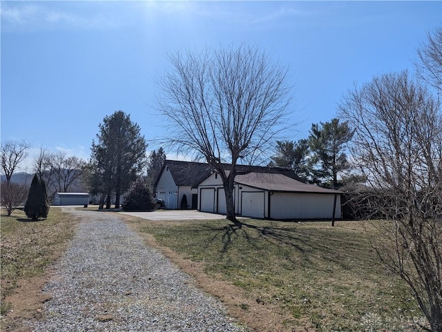 exterior space with a lawn and a garage