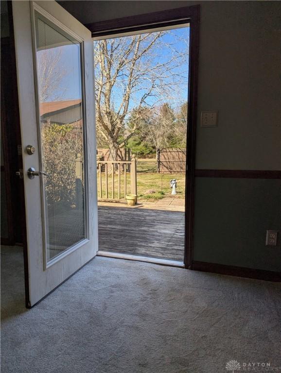 entryway with carpet floors and plenty of natural light