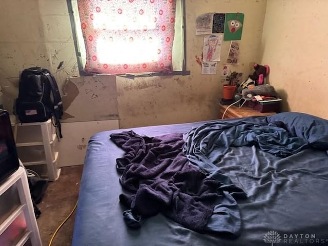 bedroom with concrete flooring