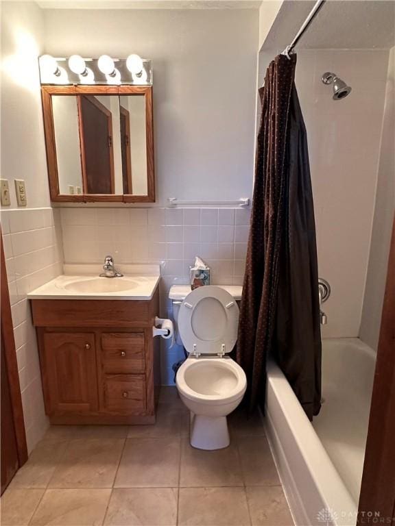 full bathroom featuring tile patterned flooring, toilet, tile walls, and vanity