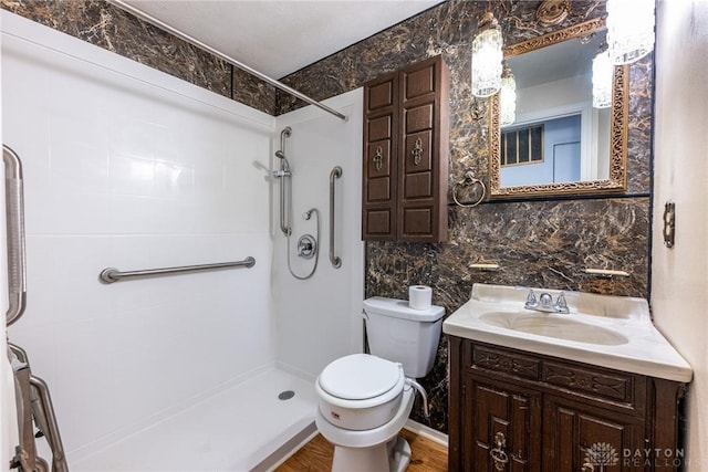 full bathroom featuring vanity, decorative backsplash, a shower, tile walls, and toilet