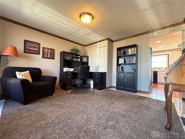 carpeted office featuring a textured ceiling, crown molding, and baseboards