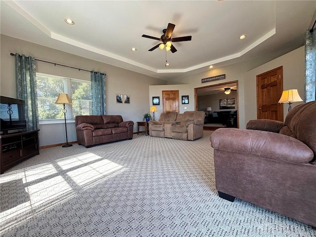 living area with recessed lighting, carpet, a tray ceiling, and ceiling fan