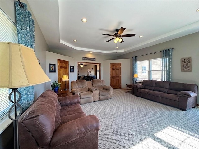 living room featuring recessed lighting, a ceiling fan, a raised ceiling, and carpet