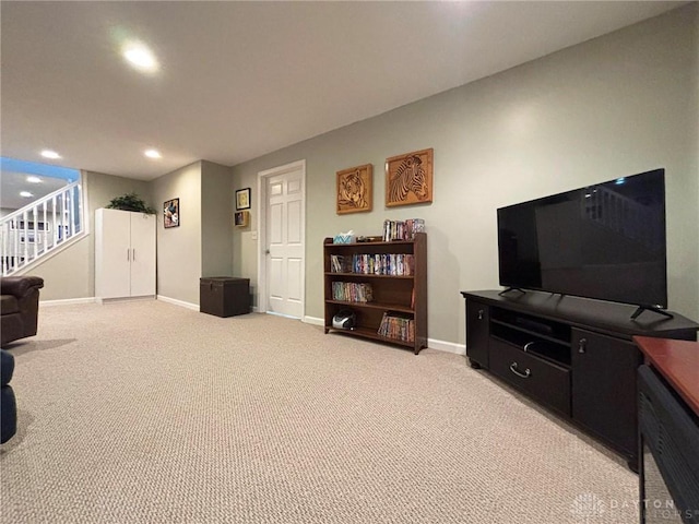 living room featuring stairs, recessed lighting, baseboards, and light carpet