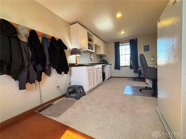 home office featuring recessed lighting, light colored carpet, visible vents, and baseboards