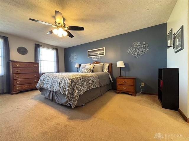 bedroom with light carpet, a textured ceiling, and ceiling fan