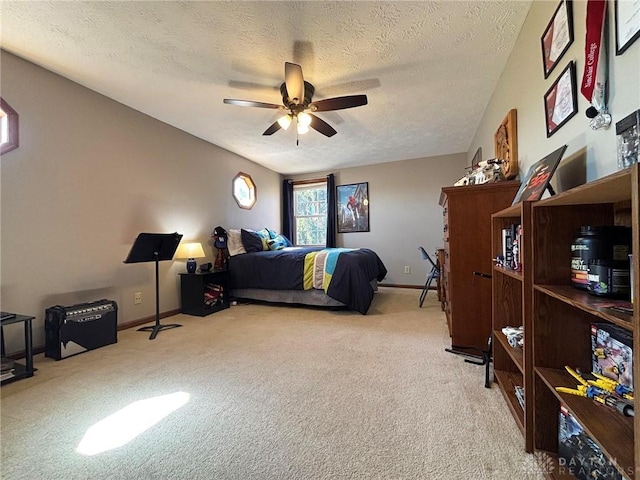 bedroom featuring baseboards, carpet, a ceiling fan, and a textured ceiling