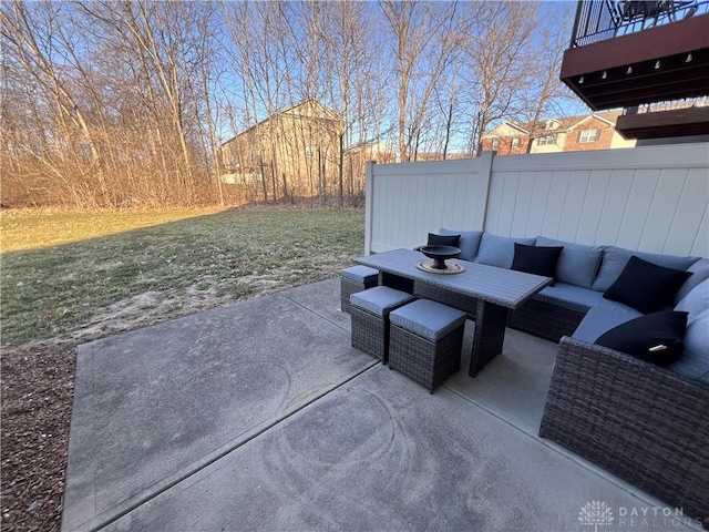 view of patio / terrace featuring an outdoor hangout area and fence