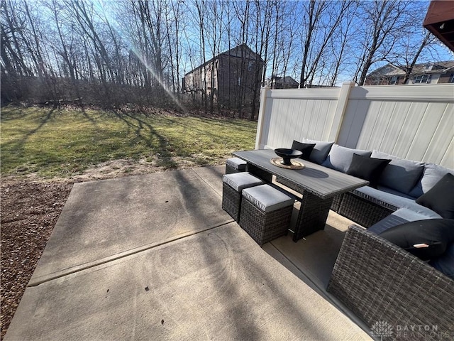 view of patio featuring an outdoor living space and fence