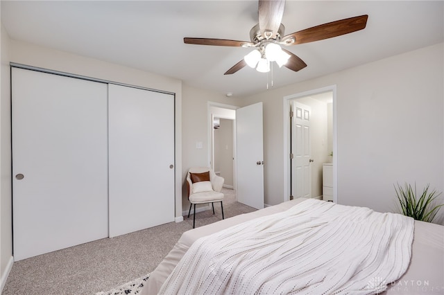 carpeted bedroom featuring a closet and ceiling fan