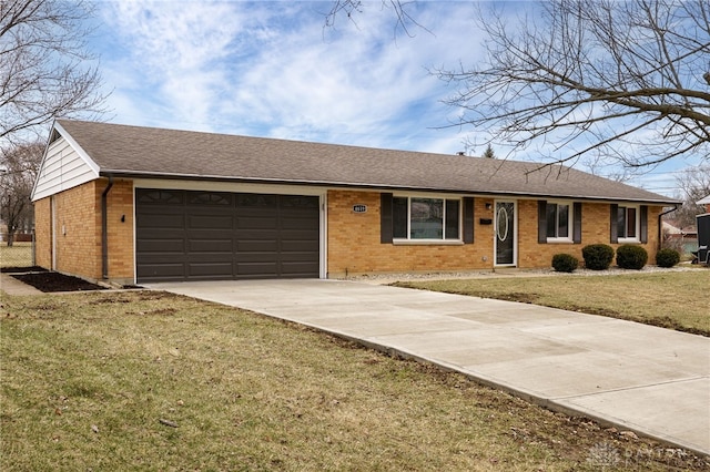 single story home featuring concrete driveway, an attached garage, brick siding, and a front yard