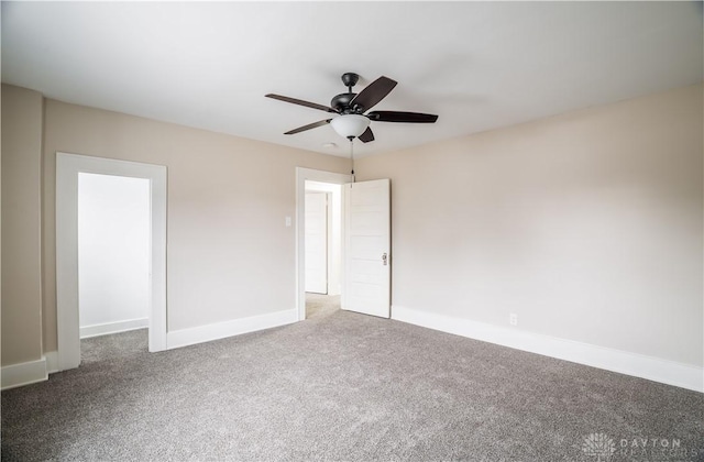 unfurnished bedroom with a ceiling fan, baseboards, and carpet floors