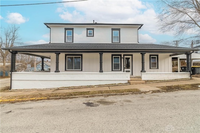 view of front of property featuring a porch and a shingled roof