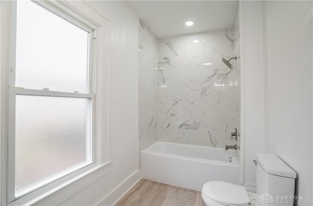 full bath with recessed lighting, toilet, wood finished floors, and  shower combination