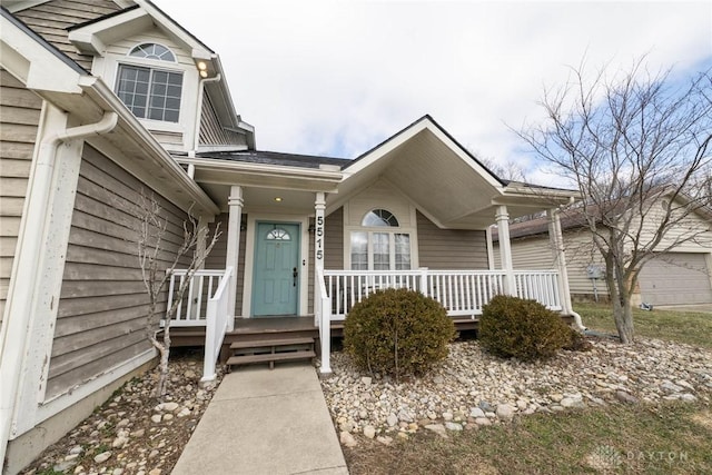 entrance to property featuring a porch