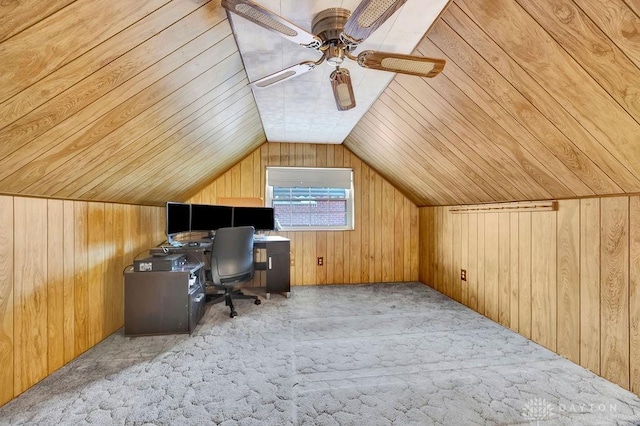 carpeted office featuring wooden walls, wooden ceiling, and lofted ceiling