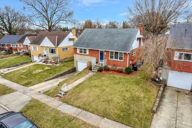 view of front of property with driveway, brick siding, an attached garage, and a front yard