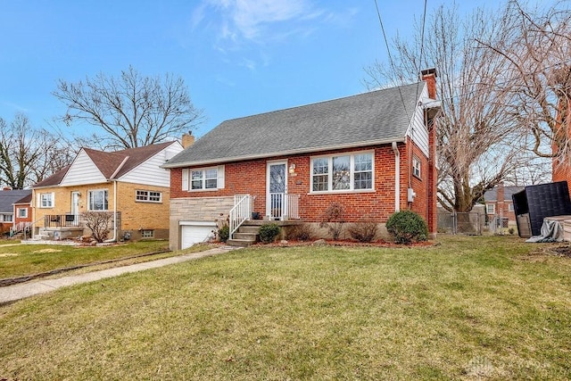 view of front of house featuring brick siding, fence, a front yard, a chimney, and an attached garage