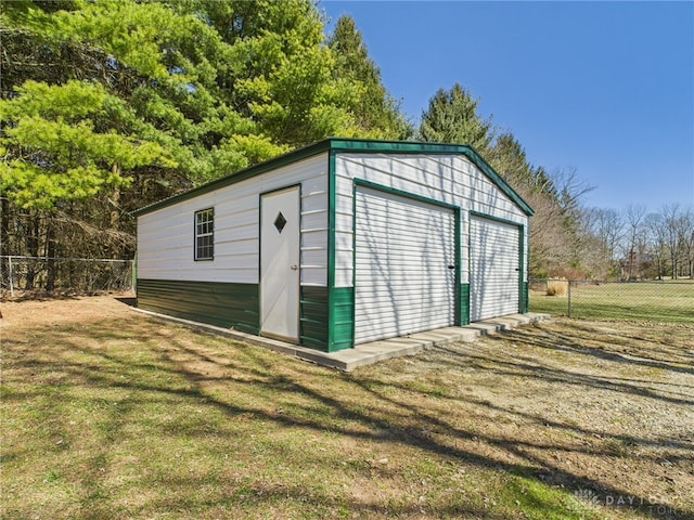 view of outbuilding featuring an outbuilding and fence