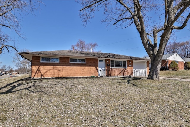 ranch-style home with an attached garage and brick siding