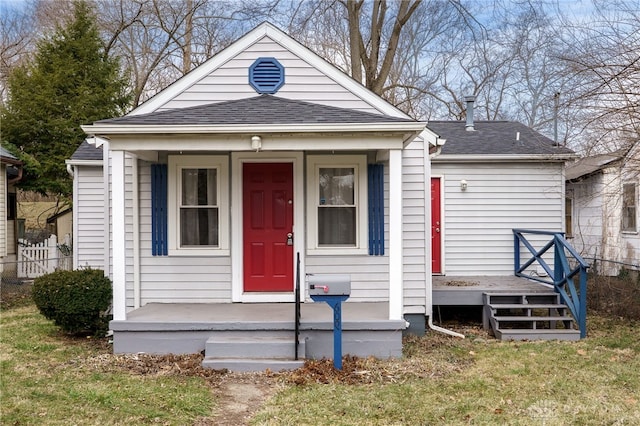 view of front facade featuring a porch and a shingled roof