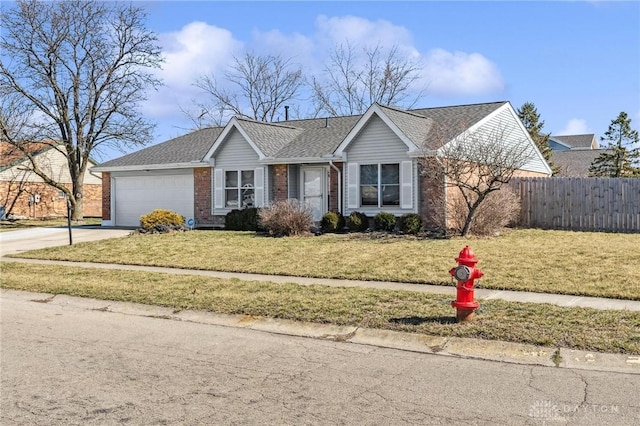 single story home featuring a front yard, fence, driveway, an attached garage, and brick siding