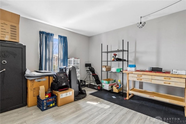 exercise area with wood finished floors