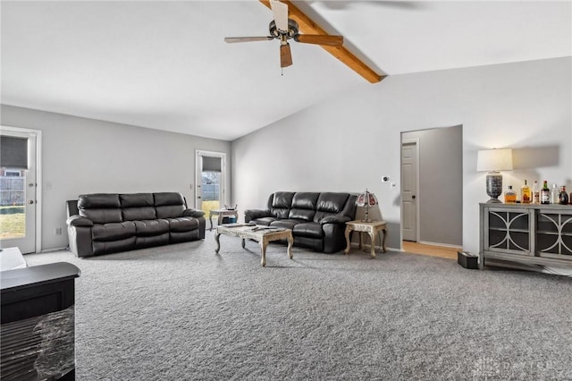 living area featuring lofted ceiling with beams, a ceiling fan, and carpet floors