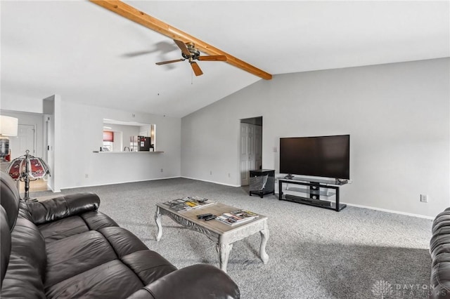 carpeted living room with baseboards, a ceiling fan, and vaulted ceiling with beams