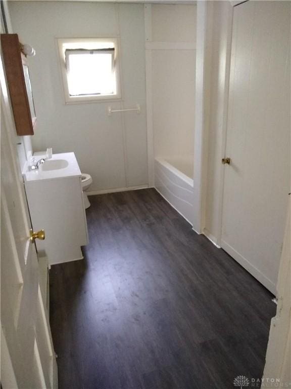 full bath featuring vanity, toilet, and wood finished floors