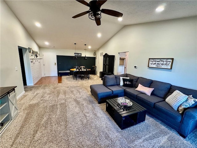 carpeted living area featuring high vaulted ceiling, recessed lighting, a textured ceiling, and a ceiling fan