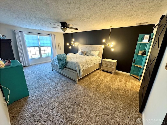 carpeted bedroom featuring baseboards, visible vents, a textured ceiling, and a ceiling fan