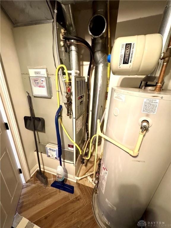 utility room with gas water heater