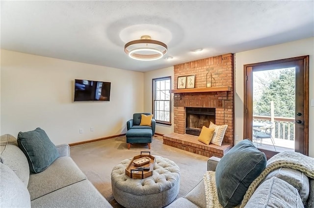 living area featuring baseboards, carpet floors, and a fireplace