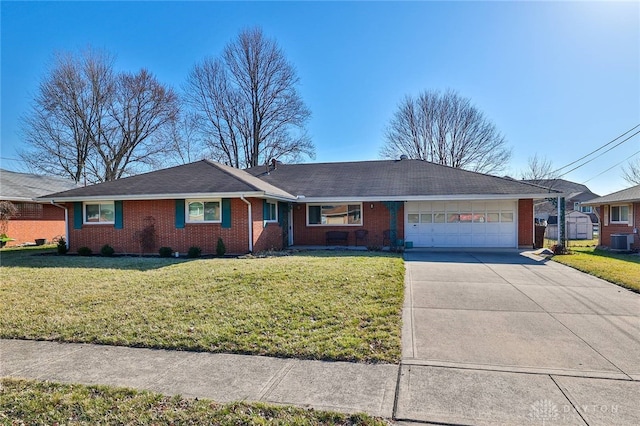 single story home with a garage, a front lawn, central AC unit, and driveway