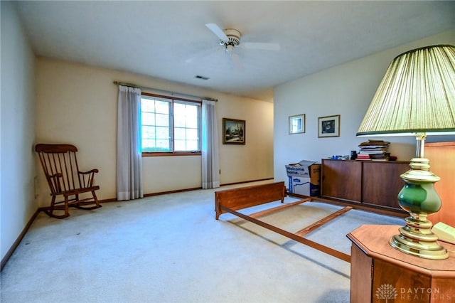 carpeted bedroom featuring baseboards, visible vents, and ceiling fan