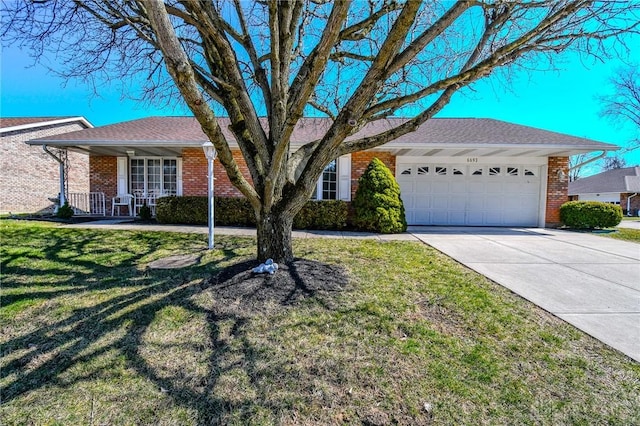 ranch-style home with a front yard, driveway, a porch, an attached garage, and brick siding