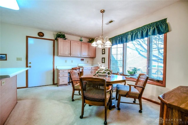 dining area with light carpet, visible vents, baseboards, and an inviting chandelier